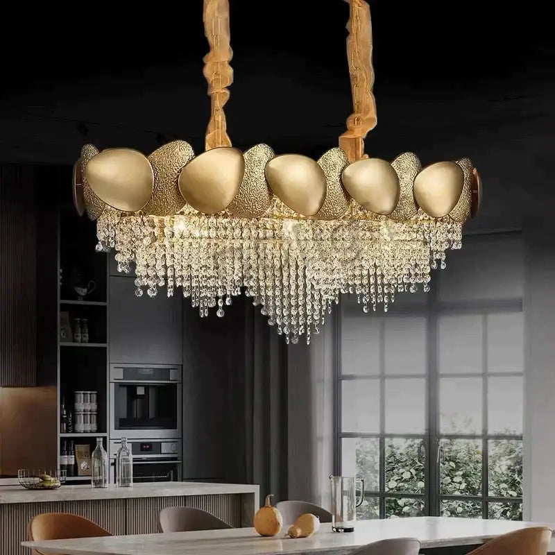 Gold-toned DecorBites™ Lizzie led ceiling chandelier with modern textured ovals and cascading crystal luxury tassels