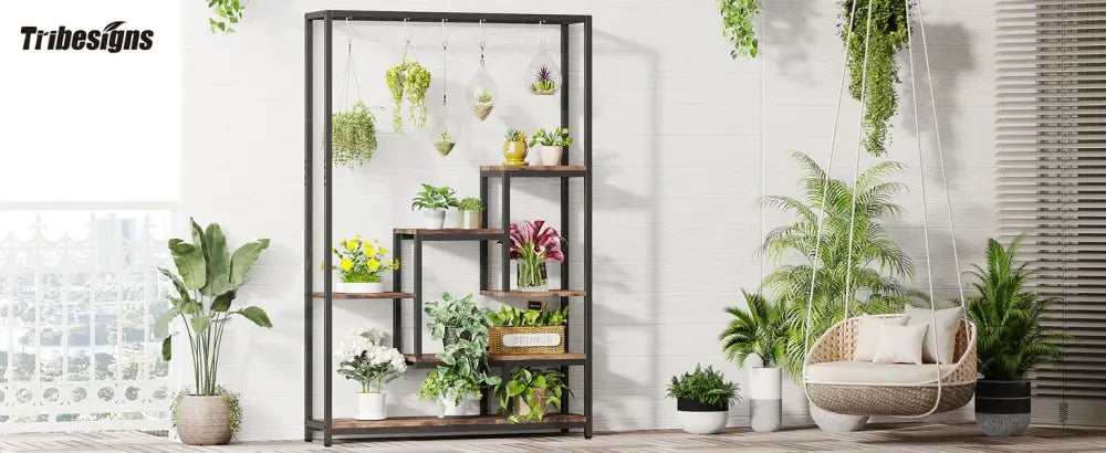 DecorBites™ 5-tier tall black metal and wood plant stand with multiple shelves and hanging hooks displaying potted plants