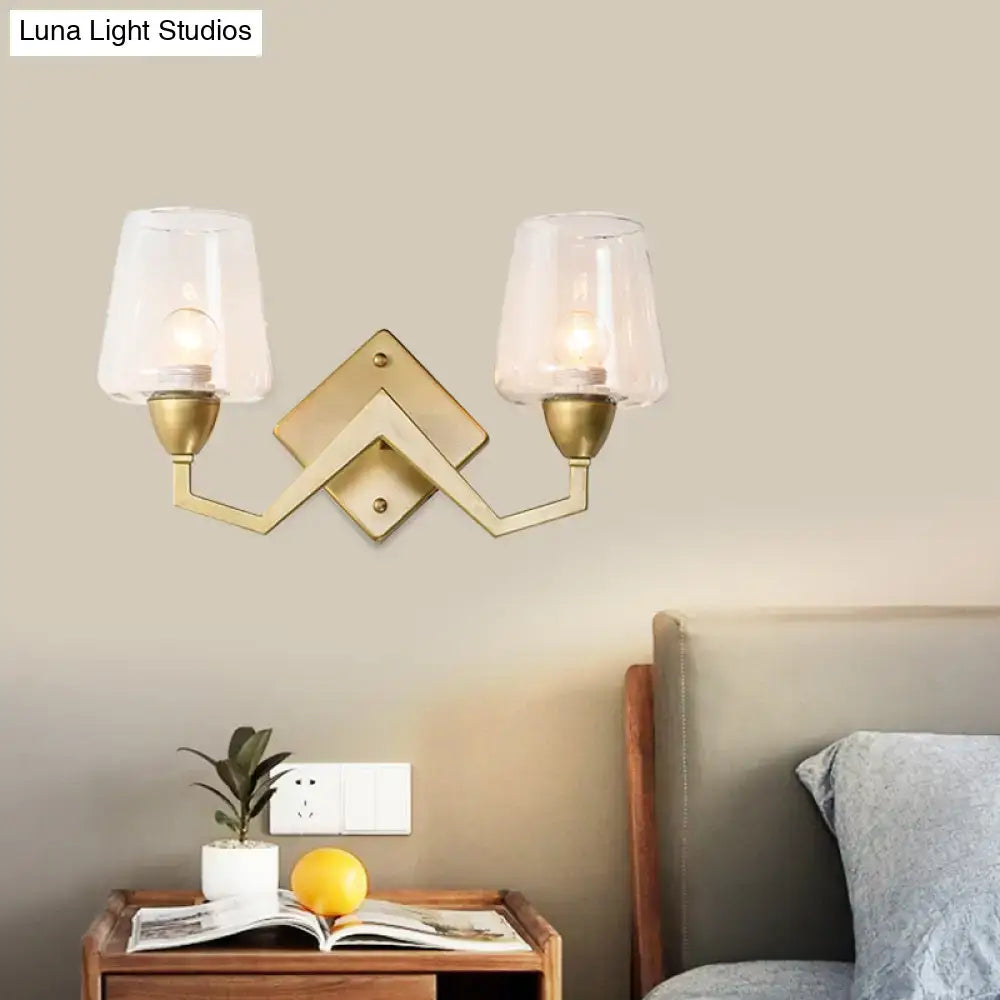 Mid-century brass wall lamp with truncated cone shade for bedroom