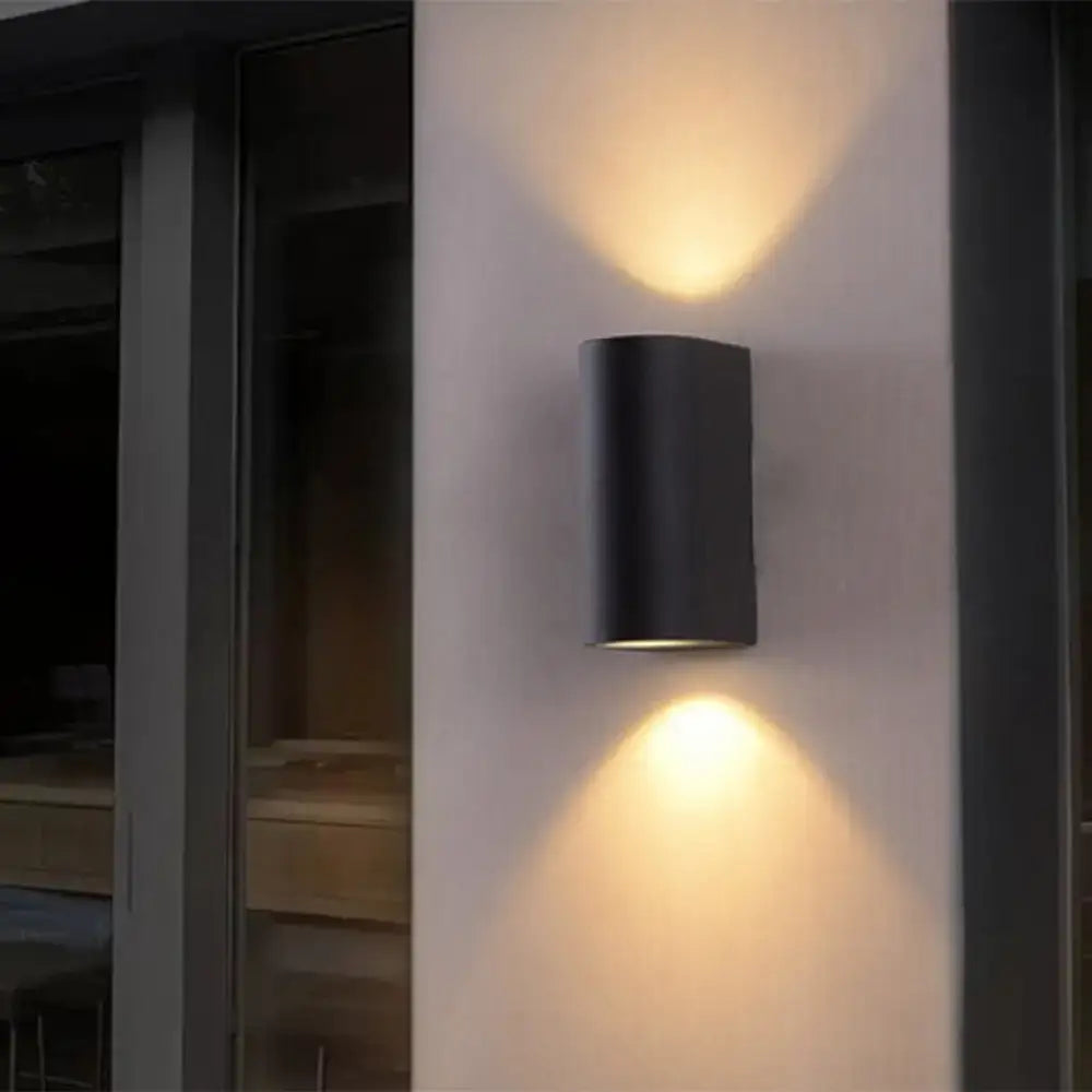 Minimalist black aluminum outdoor cylinder wall light outdoor space