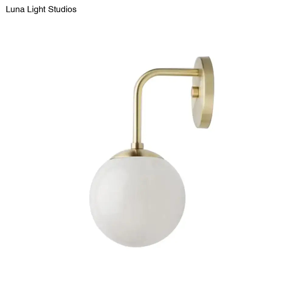 Minimalist black & gold wall light with milky glass ball for bedroom