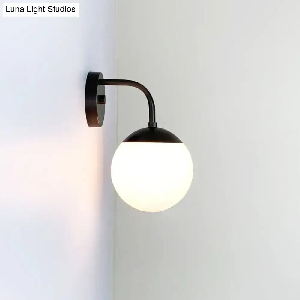 Minimalist black & gold wall light with milky glass ball for bedroom