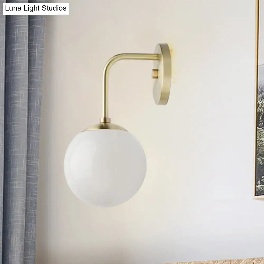 Minimalist black & gold wall light with milky glass ball for bedroom