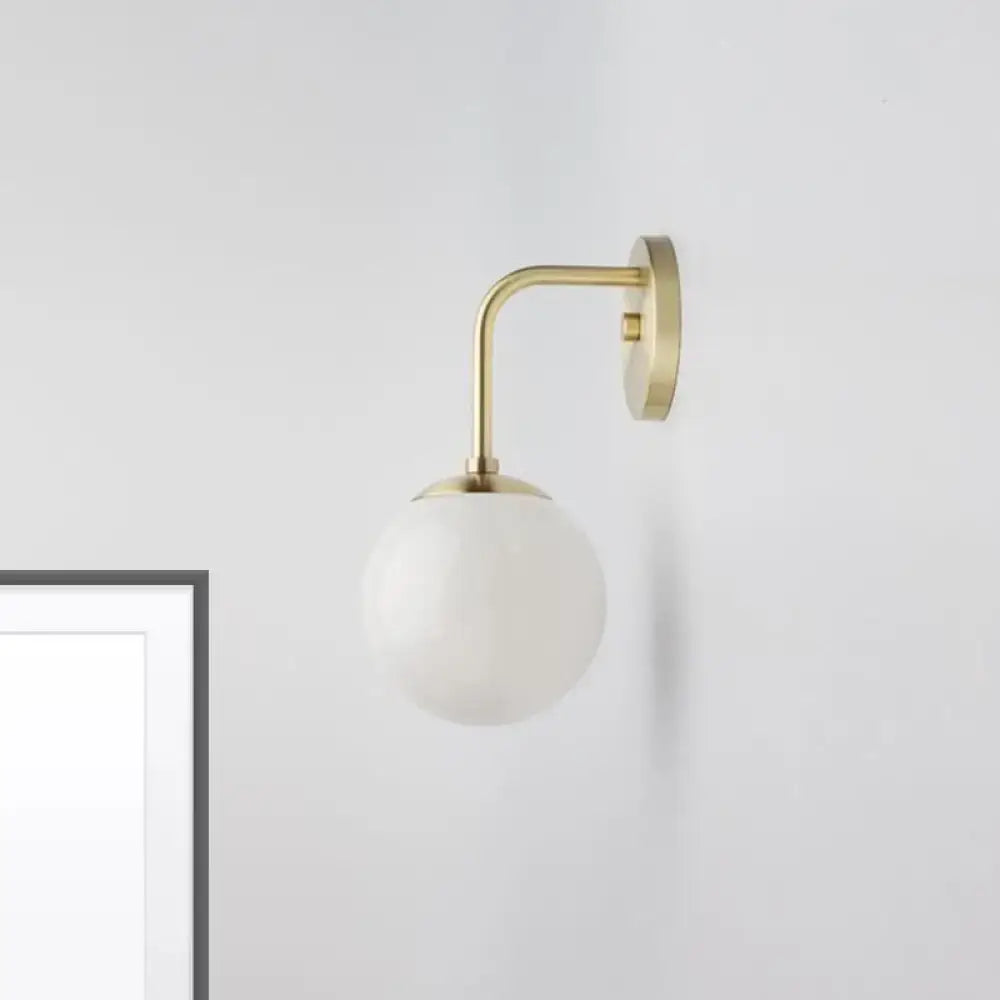 Minimalist black & gold wall light with milky glass ball for bedroom