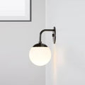 Minimalist black & gold wall light with milky glass ball for bedroom