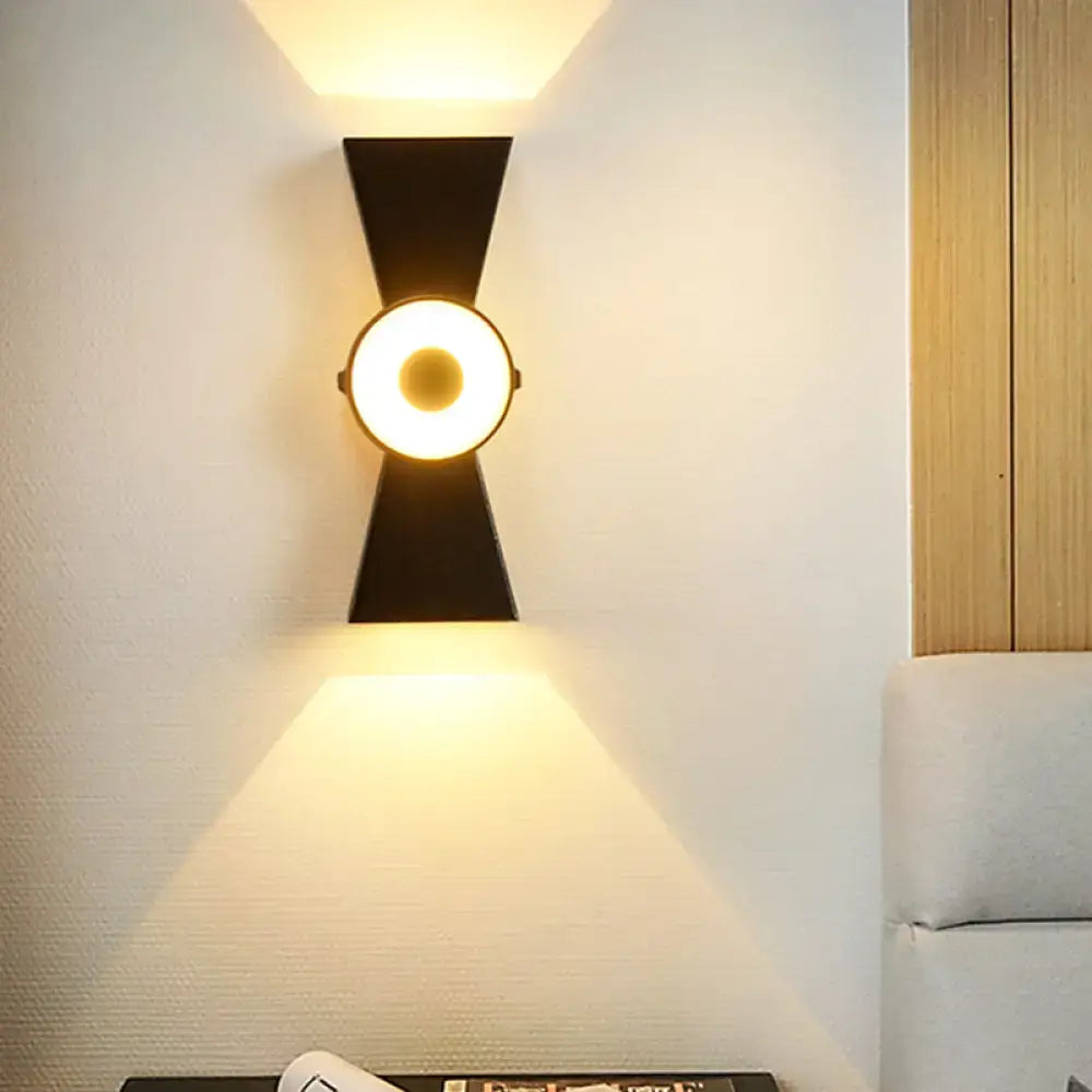 Minimalist black metal wall sconce warm white light bedroom fixture