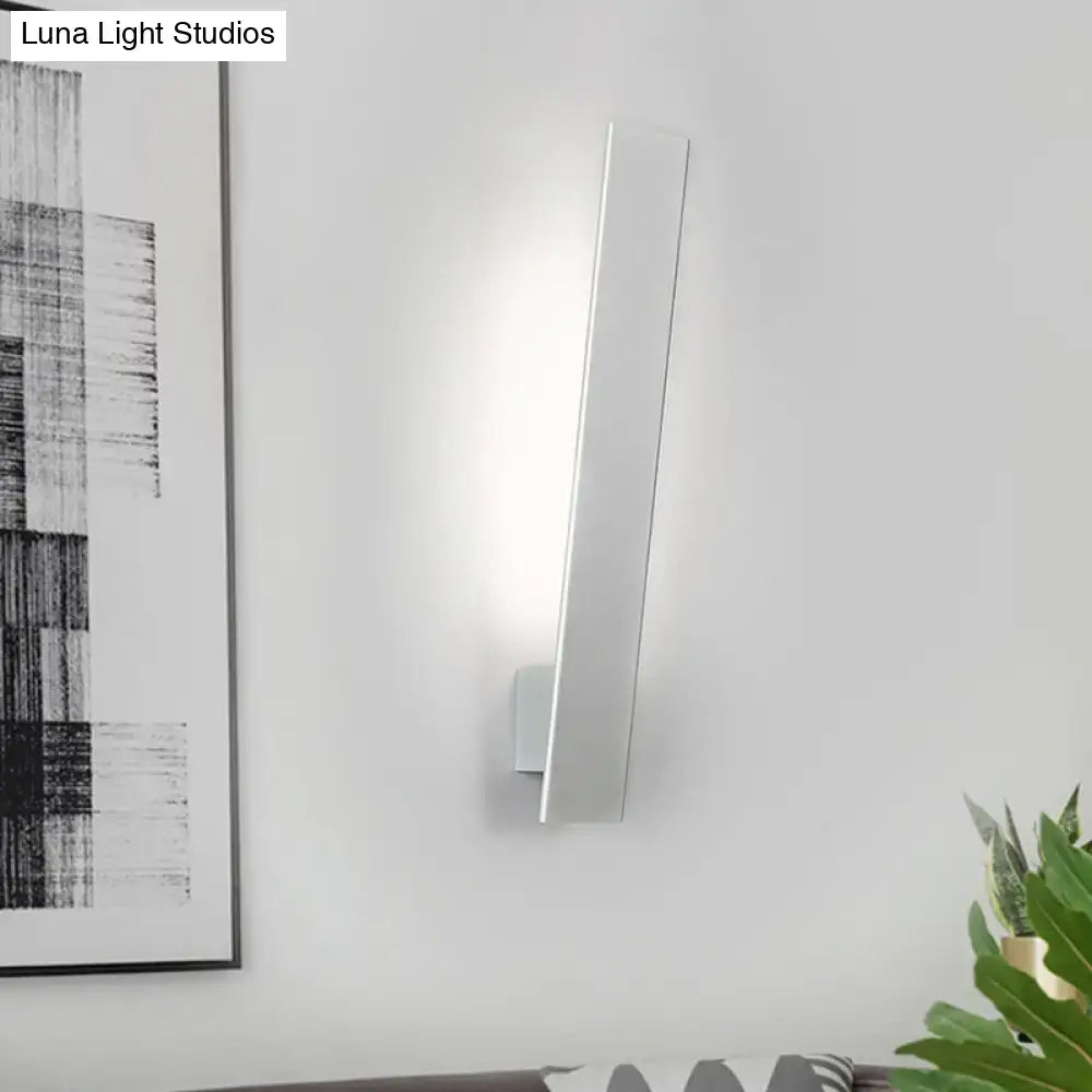 Modern white rectangular wall sconce with a sleek minimalist design featuring an aluminum shade and direct wired installation