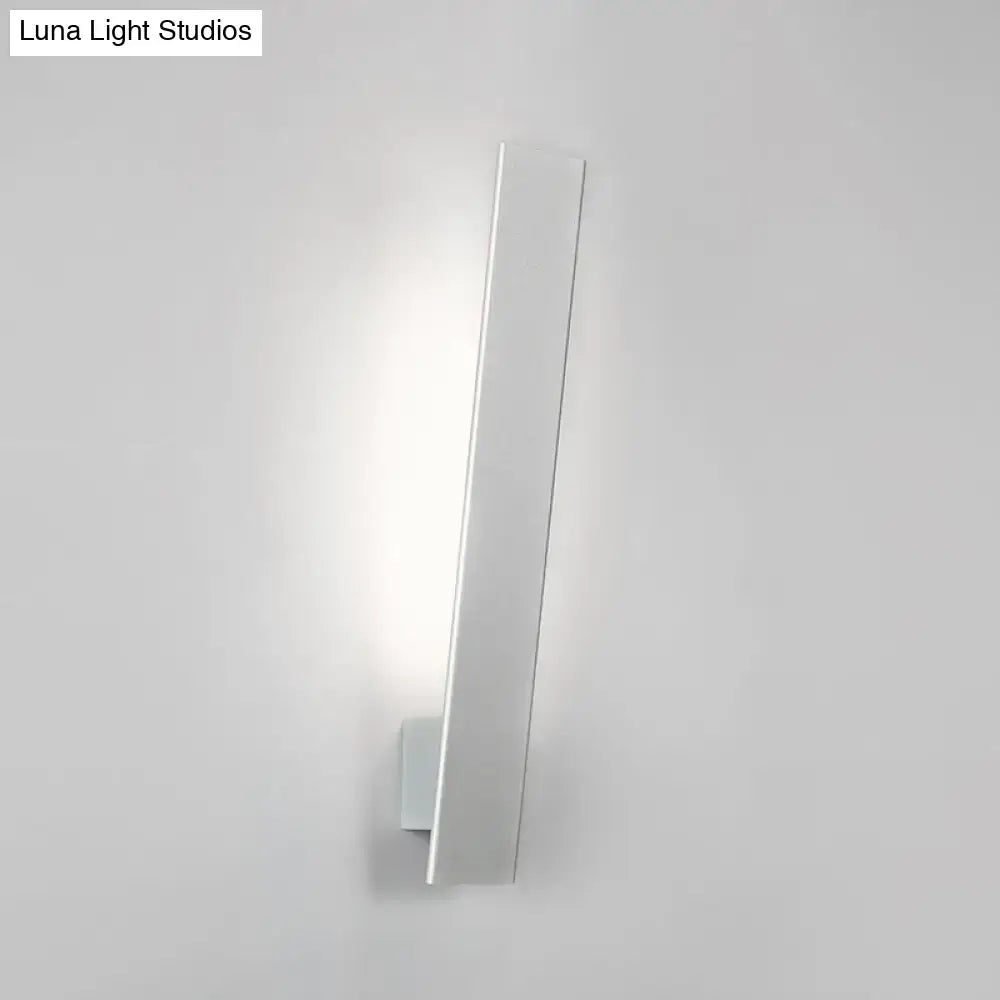 Minimalist black & white aluminum shade direct wired sconce bedroom
