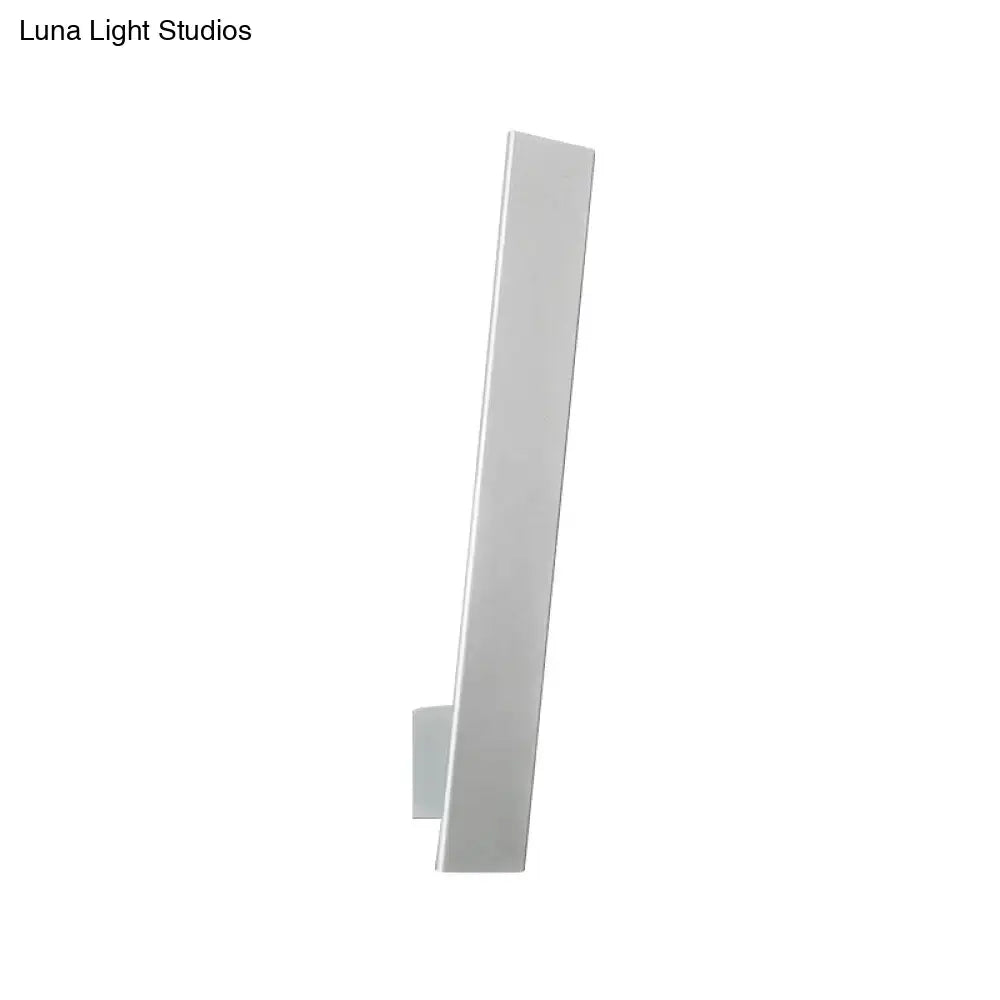 Minimalist white rectangular wall-mounted light fixture with aluminum shade and direct wired design for bedroom use