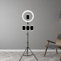Minimalist black and white mobile phone holder with ring light and three phone holders on black tripod stand for bedroom use