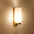 Minimalist brass and glass geometric wall sconce bedroom light