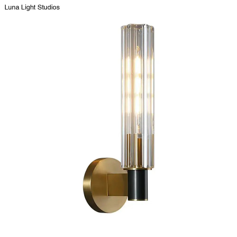 Minimalist brass finish tubular wall light sconce for bedroom