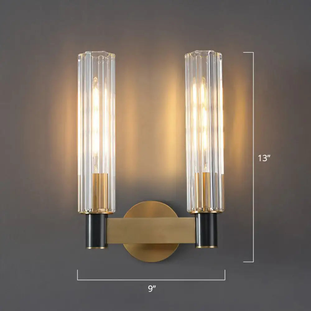 Minimalist brass finish tubular wall light sconce for bedroom