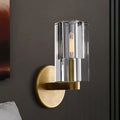 Minimalist brass wall sconce with bulb base features vertically ribbed glass shade for living room lighting type
