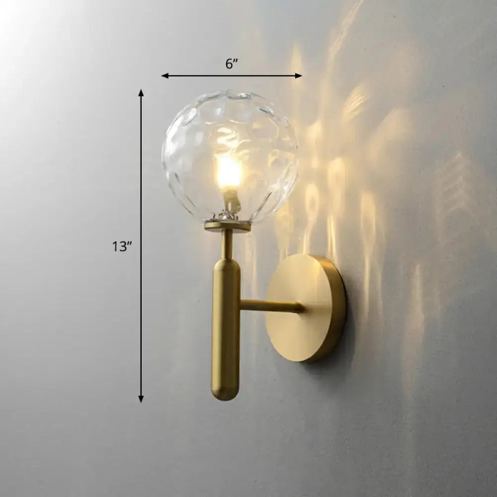 Minimalist brass wall sconce with cream glass shade for living room