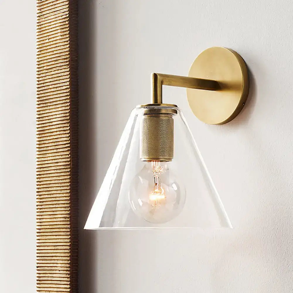 Minimalist bronze wall sconce with glass shade bedroom light