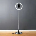 Silver minimalist circular metal mobile phone vanity light with adjustable stand and 110v-120v power for bedroom use