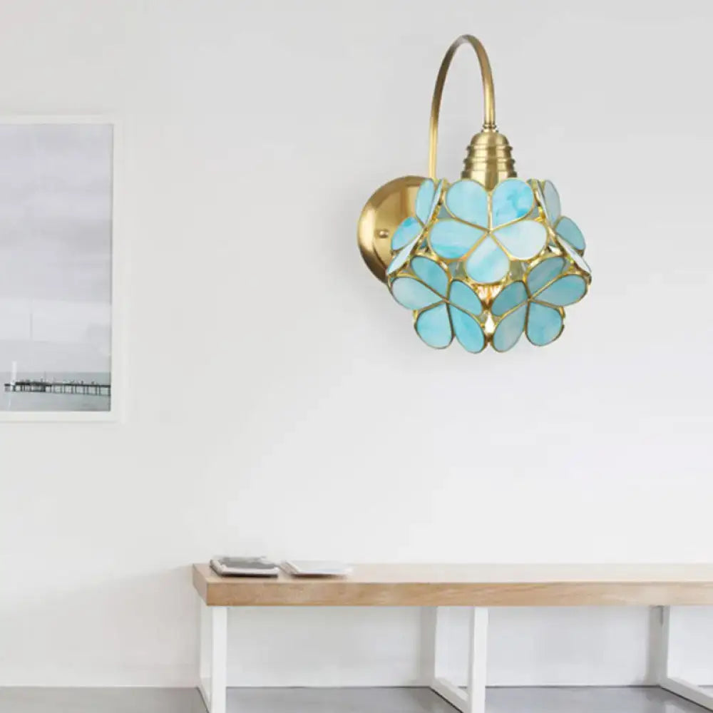 Minimalist gold floral wall sconce with glass shade for living room
