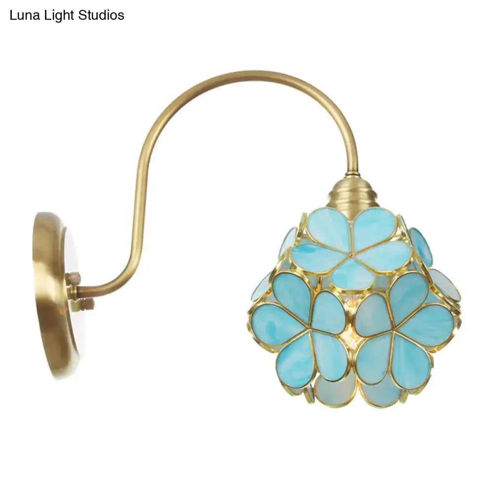 Minimalist gold floral wall sconce with glass shade for living room