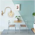 Minimalist gold floral wall sconce with glass shade for living room