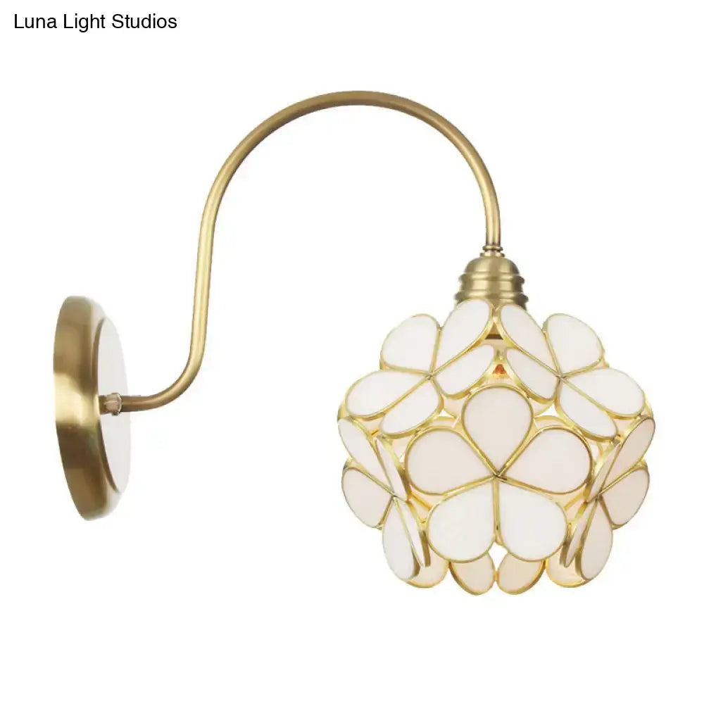 Minimalist gold floral wall sconce with glass shade for living room