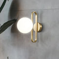 Minimalist gold oval arm wall light with cream matte glass bedroom sconce
