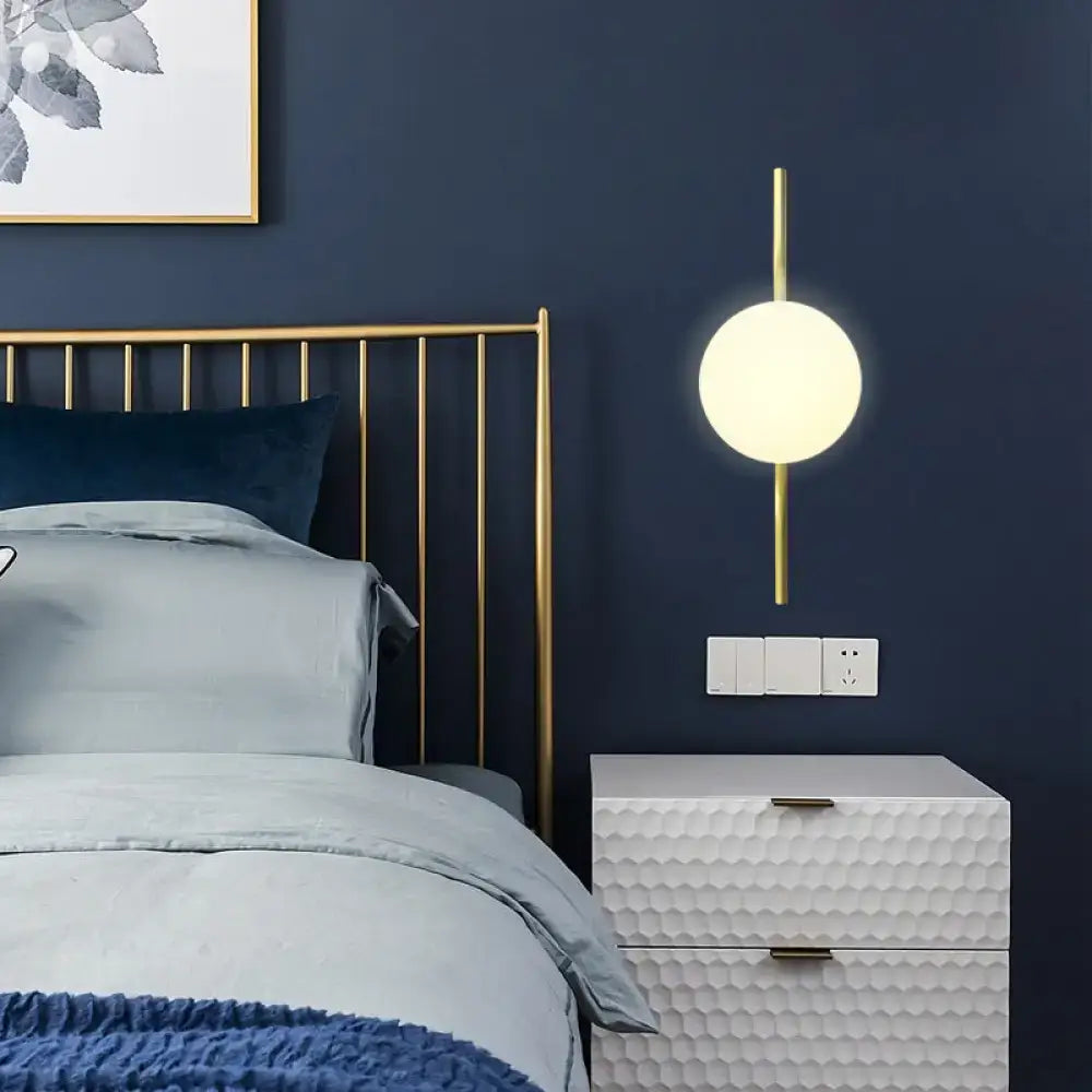 Minimalist gold wall light with white globe shade – bedroom sconce light