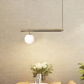 Minimalist golden glass sphere pendant light dining room