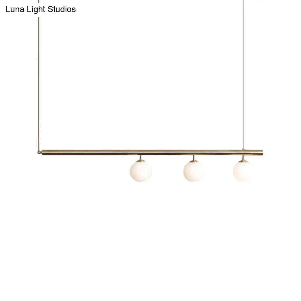 Minimalist golden glass sphere pendant light dining room
