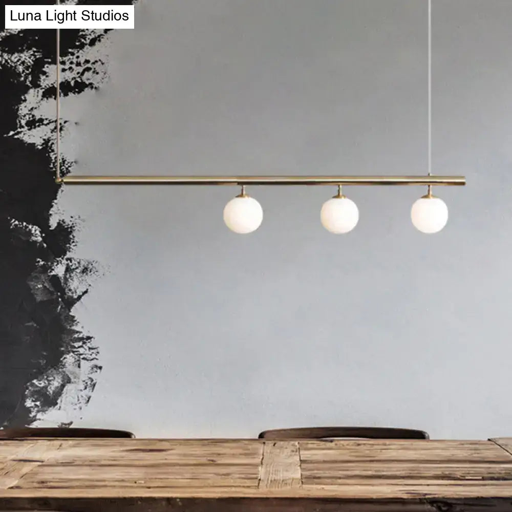 Minimalist golden glass sphere pendant light dining room