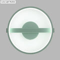 Minimalist sage green wall lamp with a matte frame and glowing white warm light LED ring for bedroom use