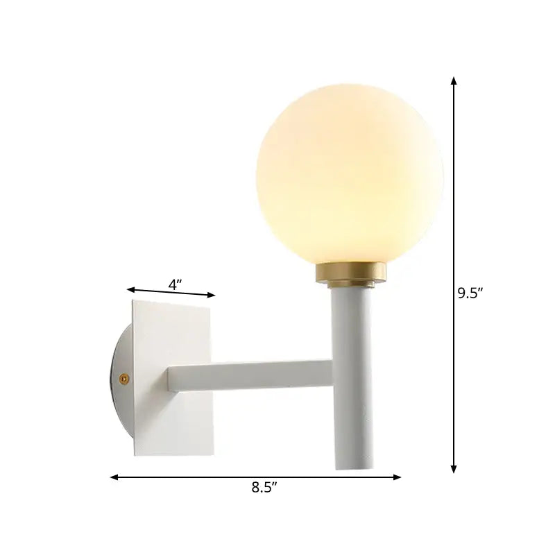 Minimalist white and brass wall lamp with opal glass shade bedroom