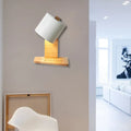 Minimalist white and green nordic wood wall sconce with white cylindrical lampshade and light wood base for bedroom lighting
