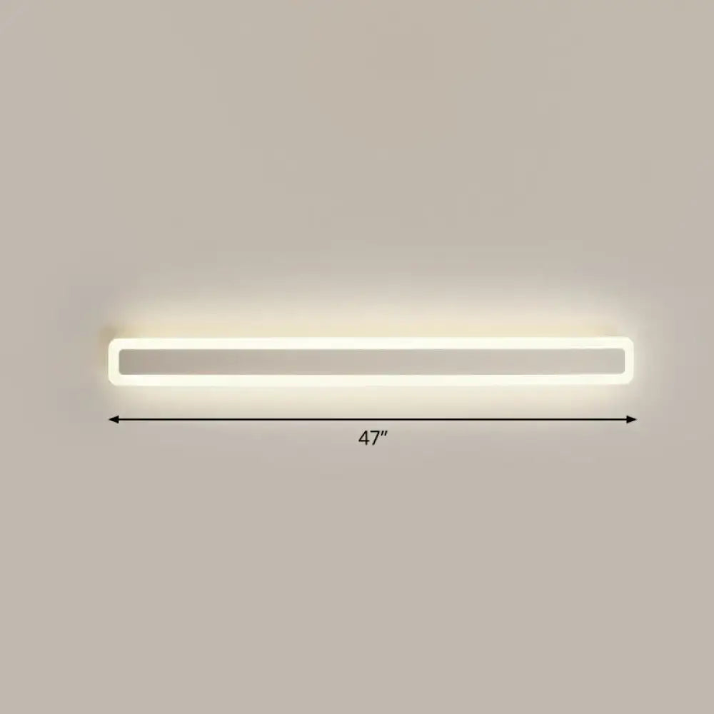 A sleek minimalist white 47-inch led vanity light wall sconce with warm third gear soft illumination for bathroom use