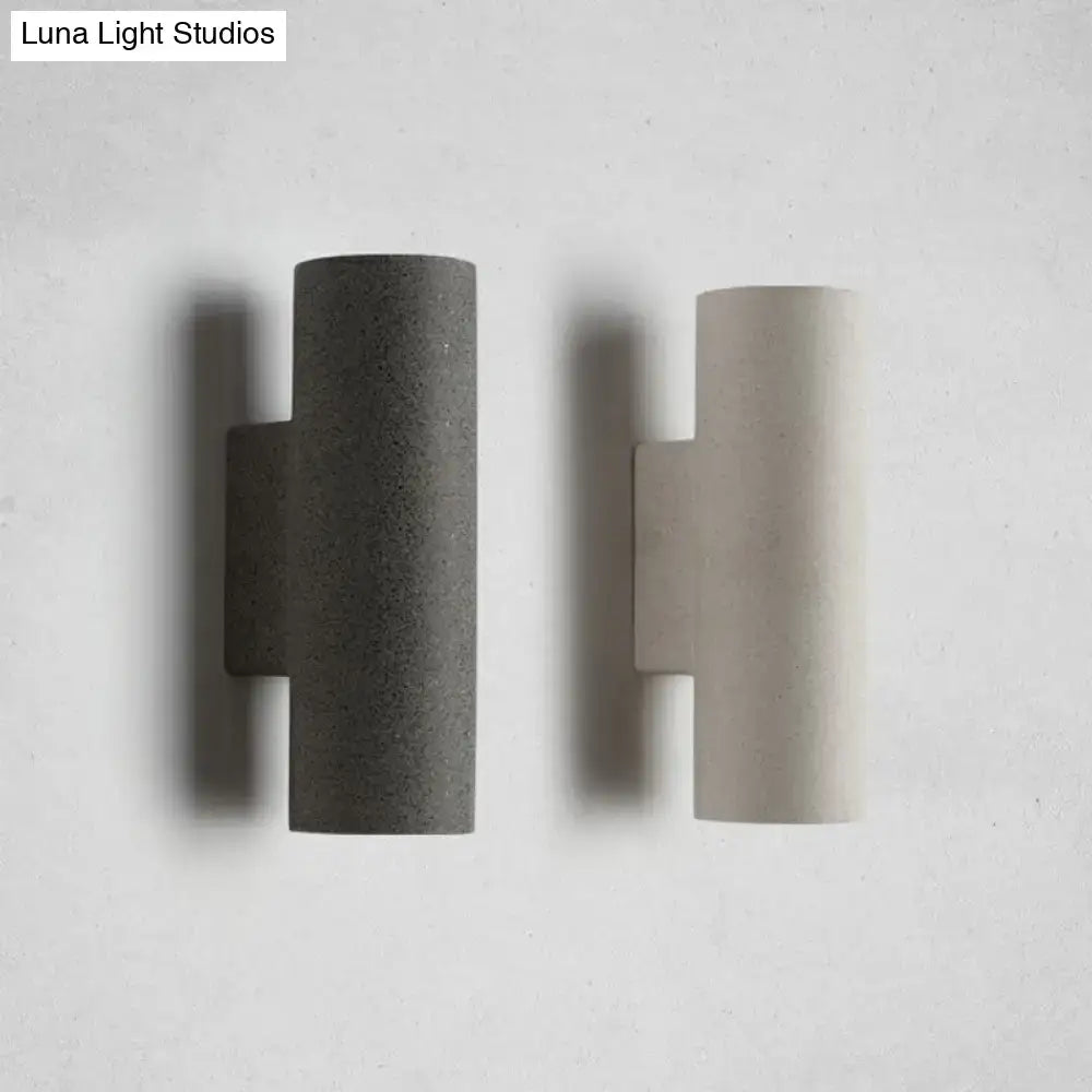 Minimalist white terrazzo stair wall sconce with compact fixture height