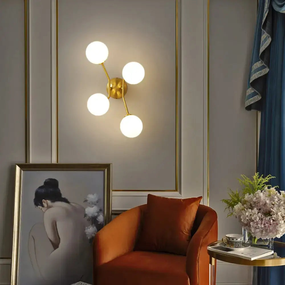 Minimalistic brass branch wall light with frosted glass for bedroom