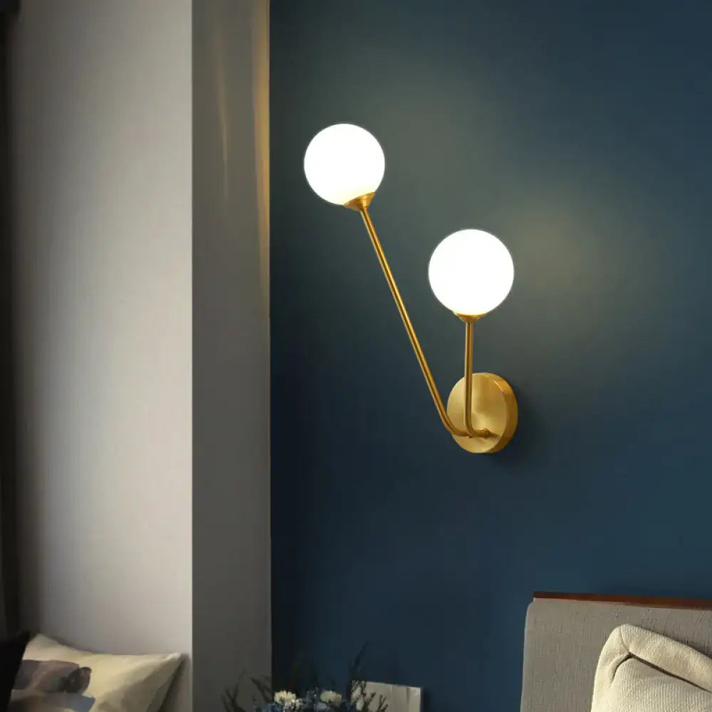 Minimalistic brass branch wall light with frosted glass for bedroom
