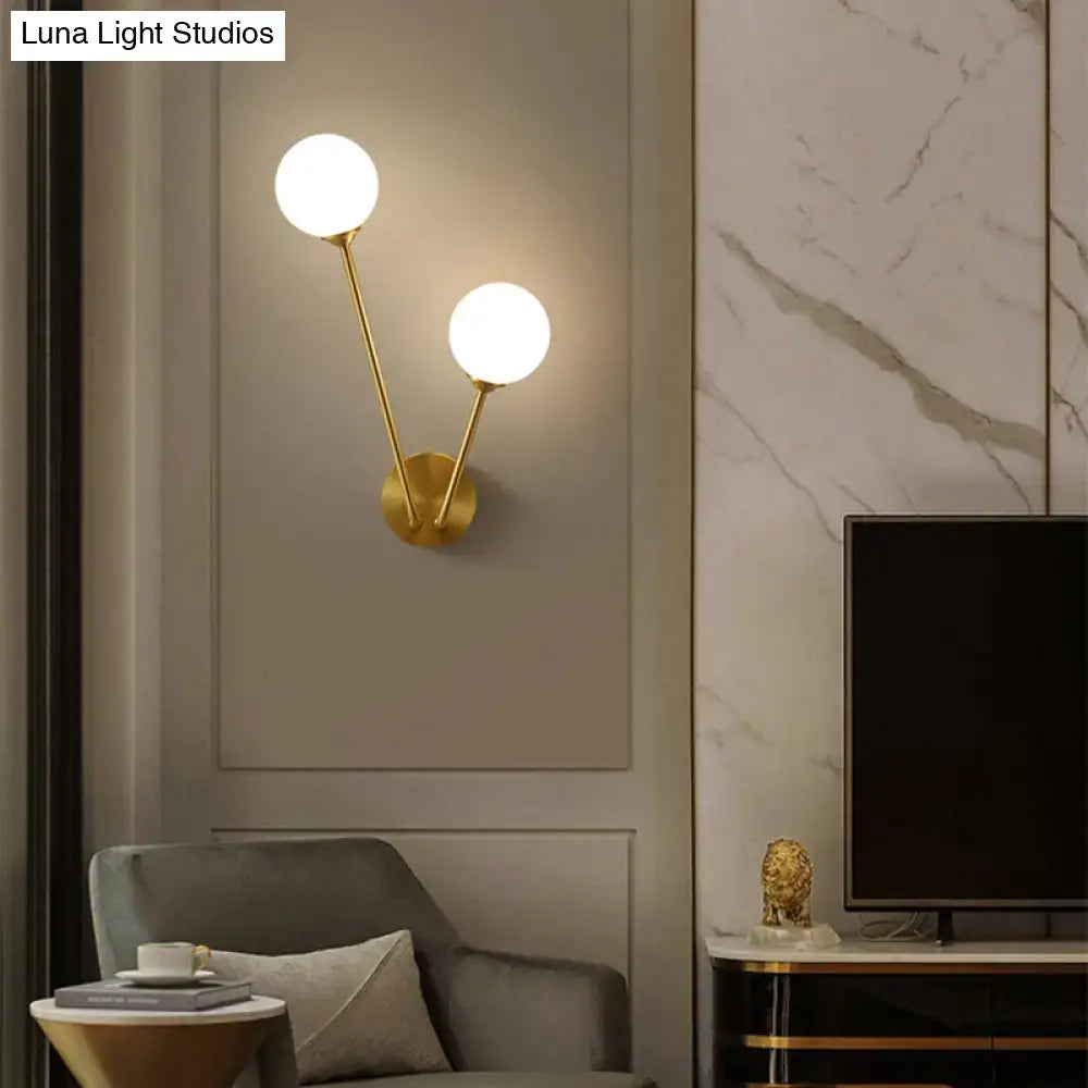Minimalistic brass branch wall light with frosted glass for bedroom
