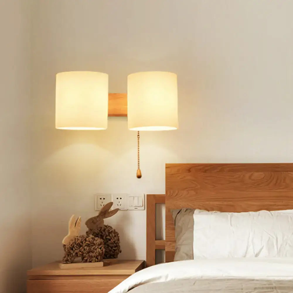 Modern beige fabric and wood wall light bedroom sconce with pull chain