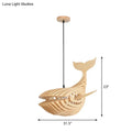 A modern hanging light beige wooden whale kids pendant lamp with a sleek layered design and black cord suspension