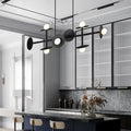 DecorBites modern black metal ceiling light fixture with circular discs and glowing white glass bulbs for kitchen use