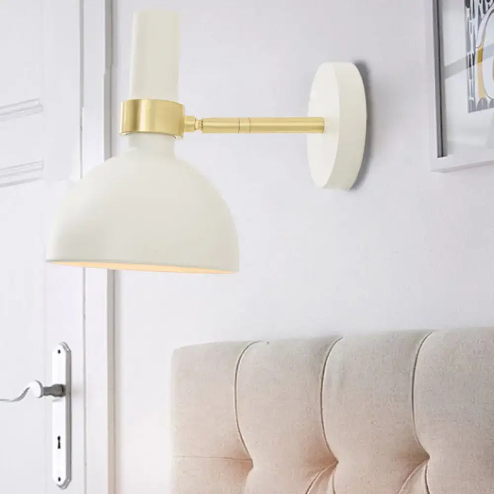 Modern black and brass domed wall lamp for bedroom bedside