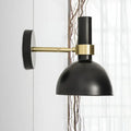 Modern black and brass domed wall lamp with matte finish and brass accent band for bedroom bedside use with led incandescent fluorescent bulbs