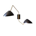 Modern black matte duckbill reading wall light with brass-colored articulated metal arms for bedroom use