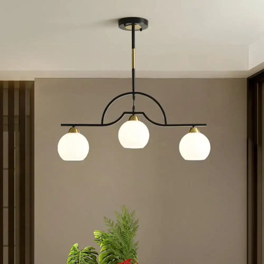 Modern black and brass pendant light with clear glass – kitchen island