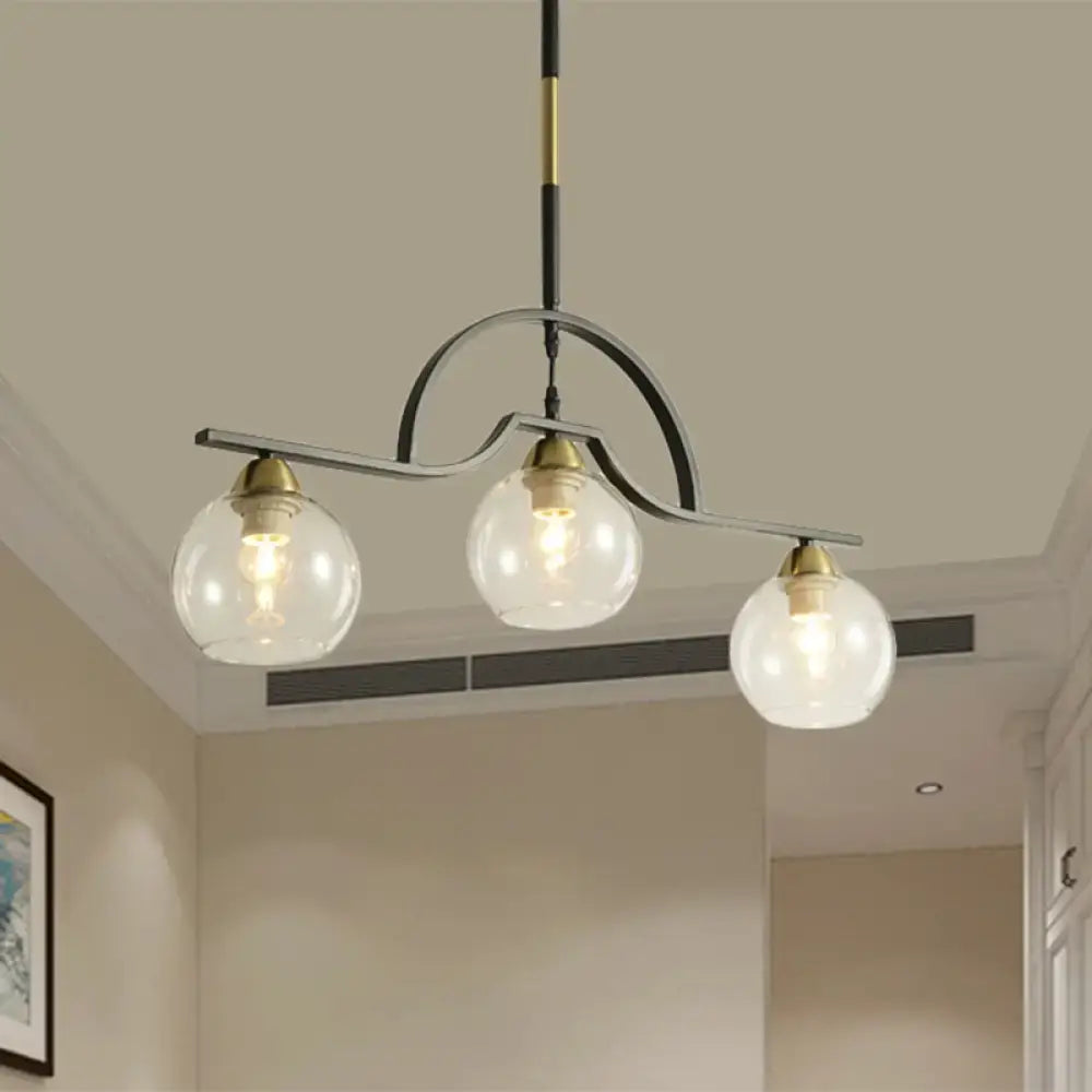 Modern black and brass pendant light with clear glass – kitchen island