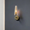 Modern black and brass wall mount light with translucent amber glass shade ideal wall light for study room