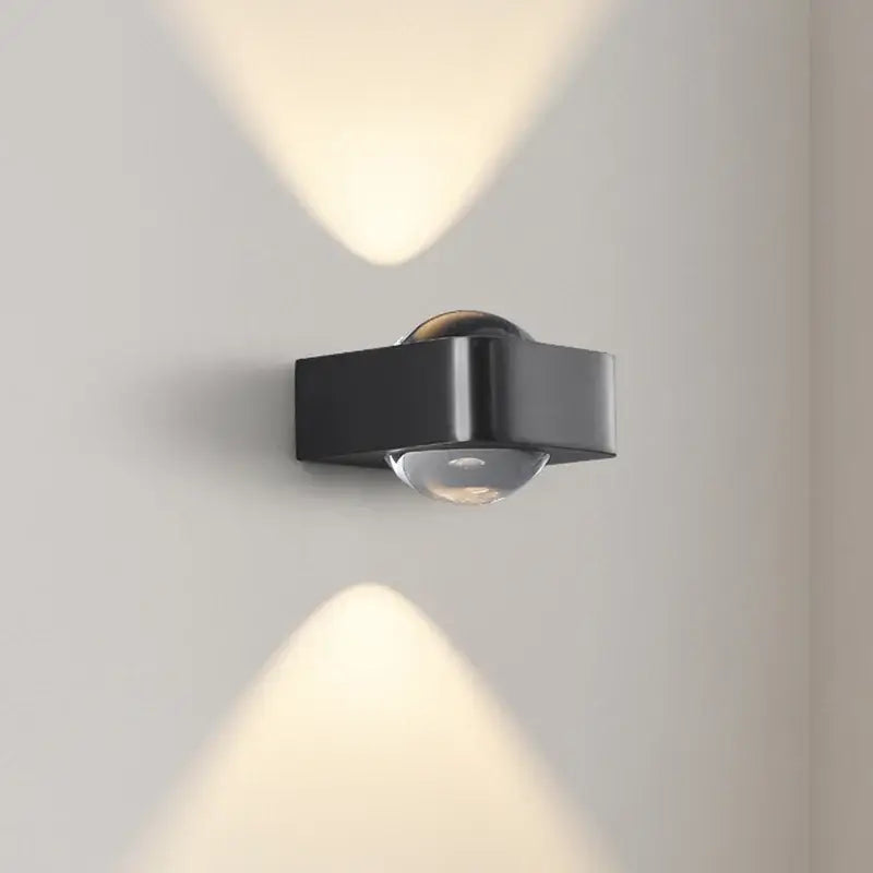Modern black and copper bedroom wall lamp with glass dome