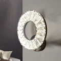 Modern black and crystal chrome wall sconce with faceted clear elements illuminating color temperature in bedroom light
