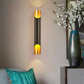 Modern black and gold tubular aluminum wall sconce with sleek cylindrical design for living room lighting